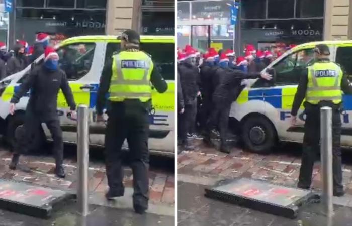 Un fan des Masked Rangers affronte la police avant de frapper une camionnette alors qu’un énorme groupe d’ultras dans SANTA HATS marche vers le match celtique